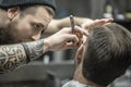 Trimming beard in barbershop Royalty Free Stock Photo