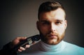 Trimming beard. Man bearded face visit hairdresser. Barber glossy hairstyle. Create style. Macho confident barber cut