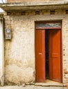 Open red door on yellow wall with power meter. Sign on walls says  House for sale  in Spanish Royalty Free Stock Photo