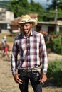 Trinidad, Cuba, August 16th, 2018: Man looking like cowboy walking on the streets of Trinidad