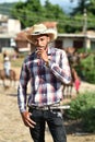 Trinidad, Cuba, August 16th, 2018: Man looking like cowboy walking on the streets of Trinidad