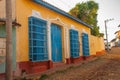 Trinidad, Cuba. Blue wooden grilles on Windows and doors. Local street in the old Cuban city.