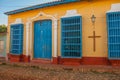 Trinidad, Cuba. Blue wooden grilles on Windows and doors. Local street in the old Cuban city.