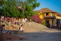 Trinidad, Cuba - December 6, 2017: People strolling in front of Casa de la Musica