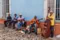 TRINIDAD, CUBA - FEB 8, 2016: Group of local musicians plays on a street in the center of Trinidad, Cub