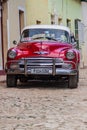 TRINIDAD, CUBA - FEB 8, 2016: Vintage Chevrolet taxi on a street in the center of Trinidad, Cub Royalty Free Stock Photo