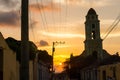 Cuban street sunset with oldtimer in Trinidad, Cuba Royalty Free Stock Photo