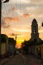 Cuban street sunset with oldtimer in Trinidad, Cuba Royalty Free Stock Photo