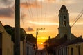 Cuban street sunset with oldtimer in Trinidad, Cuba Royalty Free Stock Photo