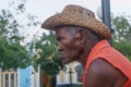 Trinidad, Cuba, January 3, 2017: old man on street smooking a cigar Royalty Free Stock Photo