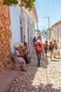 TRINIDAD, CUBA - MARCH 30, 2012: Street musicians perform songs Royalty Free Stock Photo