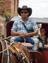 Cuban man drives a horse drawn taxi