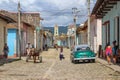 Trinidad, Cuba-November 15,2017. Street urban scene with old car and colorful Cuban houses.American classic car and lifestyle in Royalty Free Stock Photo