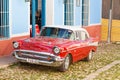 Vintage American car parked in Trinidad town