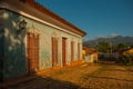 Trinidad, Cuba. Traditional Cuban street with cobblestones road and multi-colored houses.