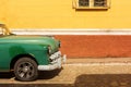 TRINIDAD - FEBRUARY 24: Streets of Trinidad with classic old car American cars are iconic sight of Cuba street