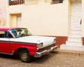 TRINIDAD - FEBRUARY 24: Streets of Trinidad with classic old car on February 24, 2015 in Trinidad. Old American cars are iconic