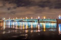 The Trinity Bridge night with backlight illumination lights with reflection in the river Neva, Saint-Petersburg. Royalty Free Stock Photo