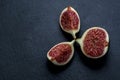 Trinity of chopped fresh figs on black shale Royalty Free Stock Photo