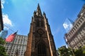 The Trinity Church seen from Wall Street in Lower Manhattan - New York City, USA Royalty Free Stock Photo