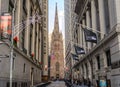 Trinity Church from Wall Street, Lower Manhattan, New York City. Street Dressed in Christmas Holiday Cheer Royalty Free Stock Photo