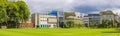 Trinity College Dublin campus with green field and buildings in the background, Ireland. The image features a view of the modern Royalty Free Stock Photo