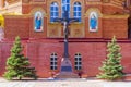 . Statue of the crucified Christ on the cross near the wall of the Cathedral of the Life-Giving Trinity. Orenburg region Royalty Free Stock Photo