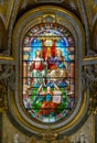 The Trinity in the stained glass of the Church of Santa Maria dell`Anima, in Rome, Italy.