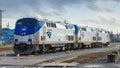 Trio of Amtrak locomotives gleaming in the bright sunlight in Seattle