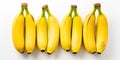 Trio of fresh, yellow bananas placed in a simple layout against a white background , concept of Minimalistic design