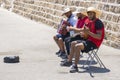 A trio of Greek musicians playing in the Old Venetian Port of Chania, Crete, Greece