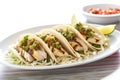 a trio of grilled mahi-mahi fish tacos on a white marble counter Royalty Free Stock Photo