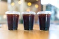 A trio of iced Americano coffee drinks set on a table in a cozy cafe Royalty Free Stock Photo