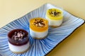 A trio of mini cheesecakes from dark to light colours