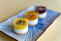 A trio of mini cheesecakes from light to dark colours