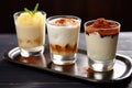 trio of mini-glasses with rice pudding drinks Royalty Free Stock Photo