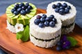 trio of rice cakes topped with avocado, blueberries, and coconut flakes Royalty Free Stock Photo