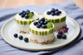trio of rice cakes topped with avocado, blueberries, and coconut flakes Royalty Free Stock Photo