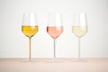 trio of rose wine glasses with varying shades from light to dark Royalty Free Stock Photo