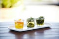 trio of seaweed salad samples in small glass cups, tasting menu
