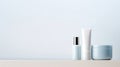 A trio of sleek cosmetic bottles with a minimalist design on a muted backdrop, perfect for branding