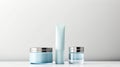 A trio of sleek cosmetic bottles with a minimalist design on a muted backdrop, perfect for branding