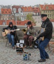 Trio of street musicians. on the Charles bridge in the historical center of old Prague. Czech Republic, Europe, autumn. Royalty Free Stock Photo