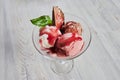 Trio of tasty chocolate vanilla and strawberry flavored frozen dessert in a blue bowl with two wafer straws.