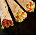 Trio of Tex Mex Fajita Wraps on Black Background