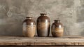 A trio of vases with a speckled sandlike texture created by layering different shades of glaze to achieve a natural and