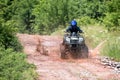 A trip on the ATV on the red road Royalty Free Stock Photo