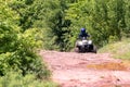 A trip on the ATV on the red road Royalty Free Stock Photo