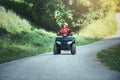 A trip on the ATV on the red road Royalty Free Stock Photo