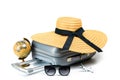 Trip isolated. Womens accessories traveler: suitcase, straw hat, sunglasses, toy plane and globe isolated on white background with Royalty Free Stock Photo